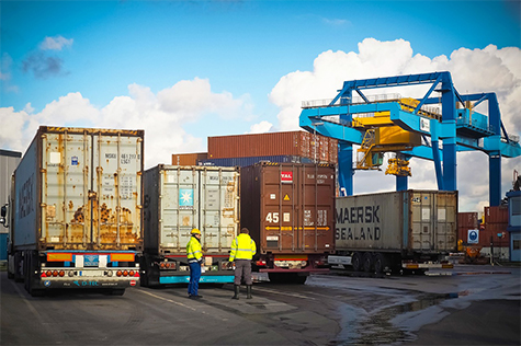 Port logistics with cranes and shipping containers